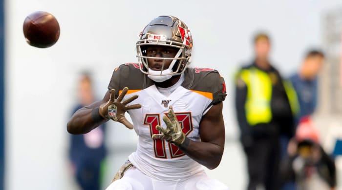 Nov 3, 2019; Seattle, WA, USA; Tampa Bay Buccaneers wide receiver Chris Godwin (12) catches a pass while being defended by Seattle Seahawks cornerback Shaquill Griffin (26) during the second half at CenturyLink Field. Seattle defeated Tampa Bay 40-34. Mandatory Credit: Steven Bisig-USA TODAY Sports